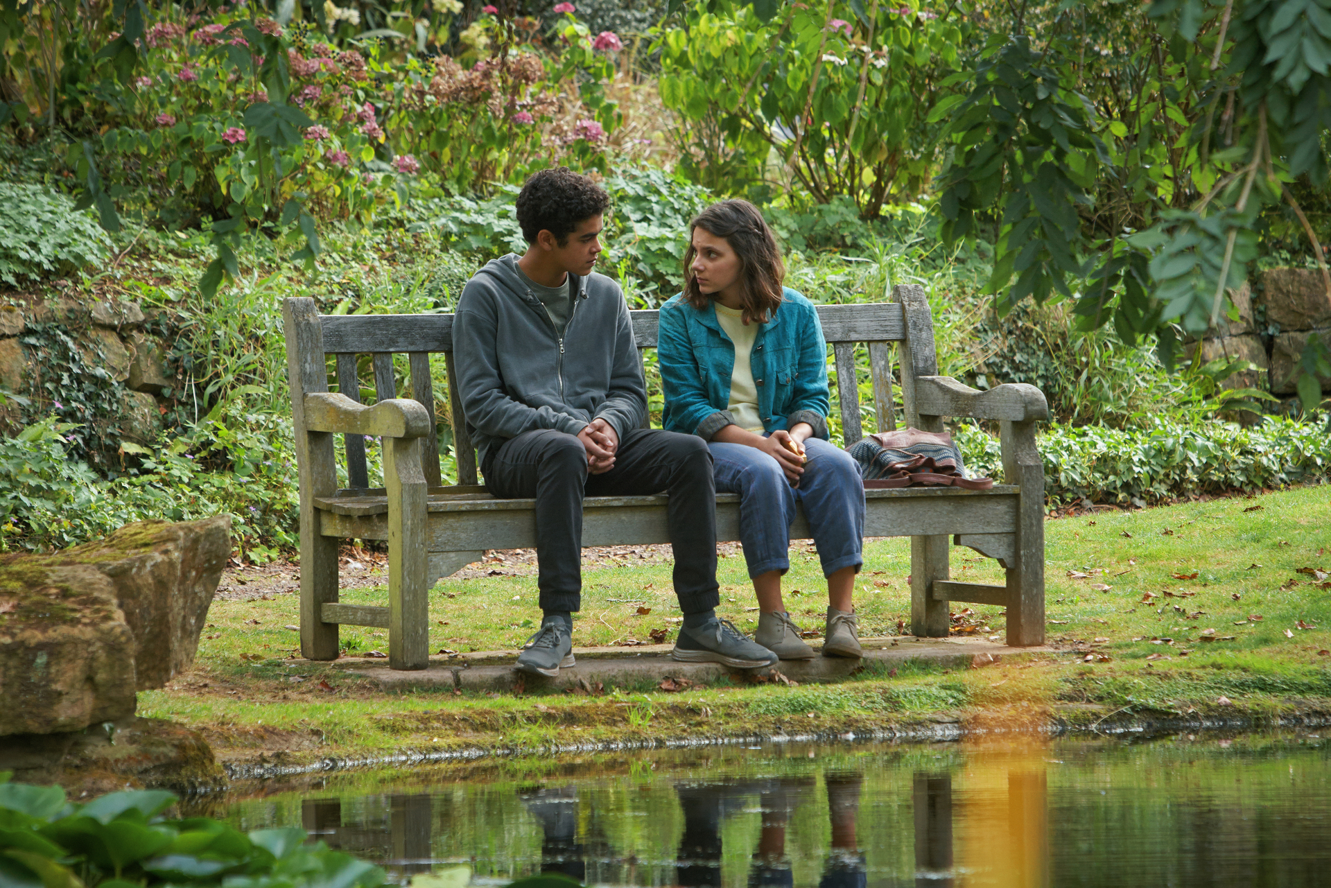 His Dark Materials - Will and Lyra sitting on a bench