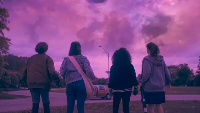 Paper Girls quartet looking upward at an ominously pink sky, paper girls season 1 review
