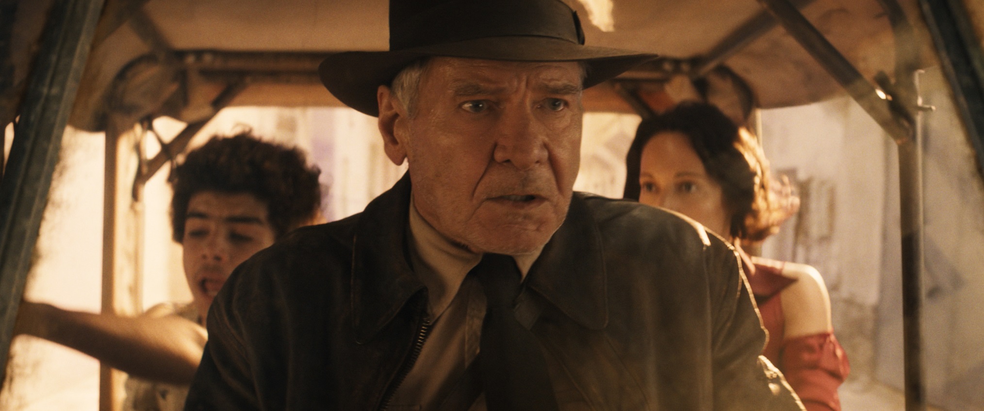 (L-R): Teddy (Ethann Isidore), Indiana Jones (Harrison Ford) and Helena (Phoebe Waller-Bridge) in Lucasfilm's INDIANA JONES AND THE DIAL OF DESTINY