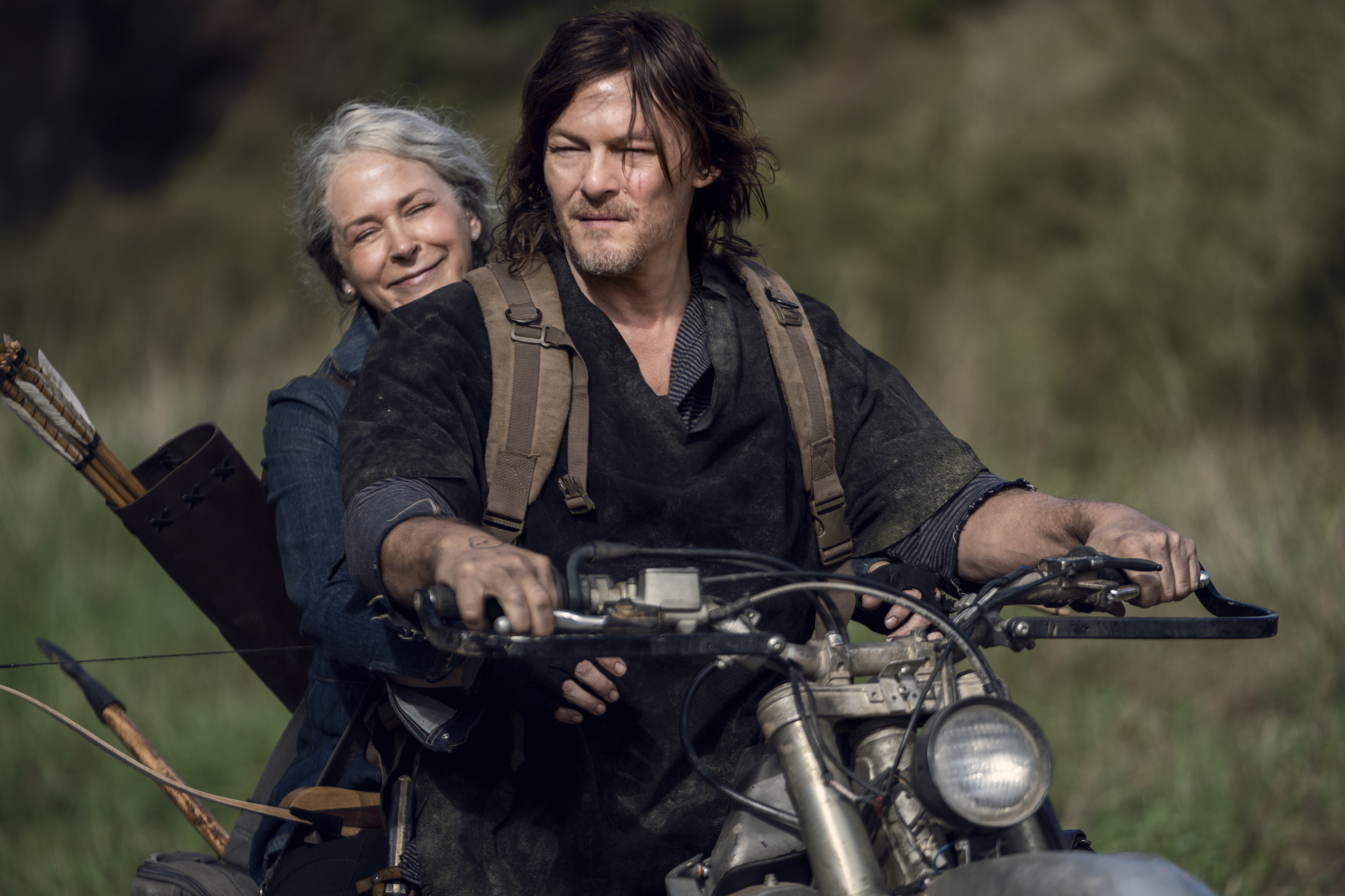 Carol riding a motorcycle with Daryl on The Walking Dead