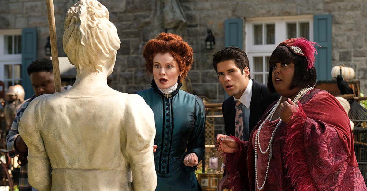 Hetty, Trevor, and Alberta look at a statue of Sam in Ghosts' "Halloween 4: The Witch."