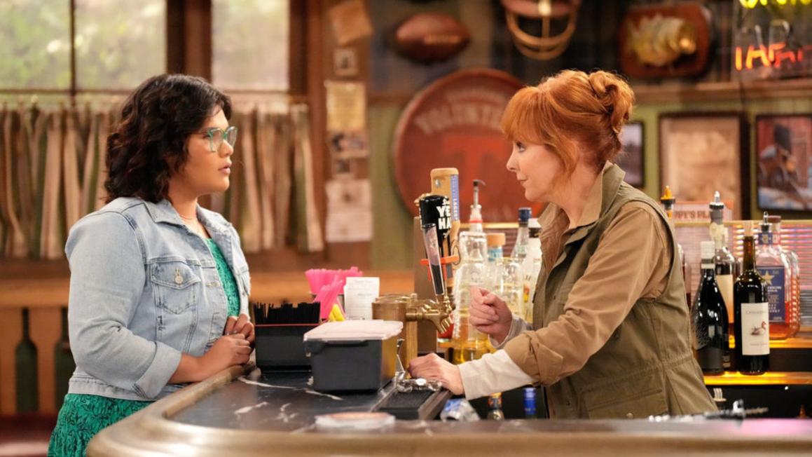 HAPPY'S PLACE -- "Fish Fry Monday" Episode 104 -- Pictured: (l-r) Belissa Escobedo as Isabella, Reba McEntire as Bobbie -- (Photo by: Casey Durkin/NBC)