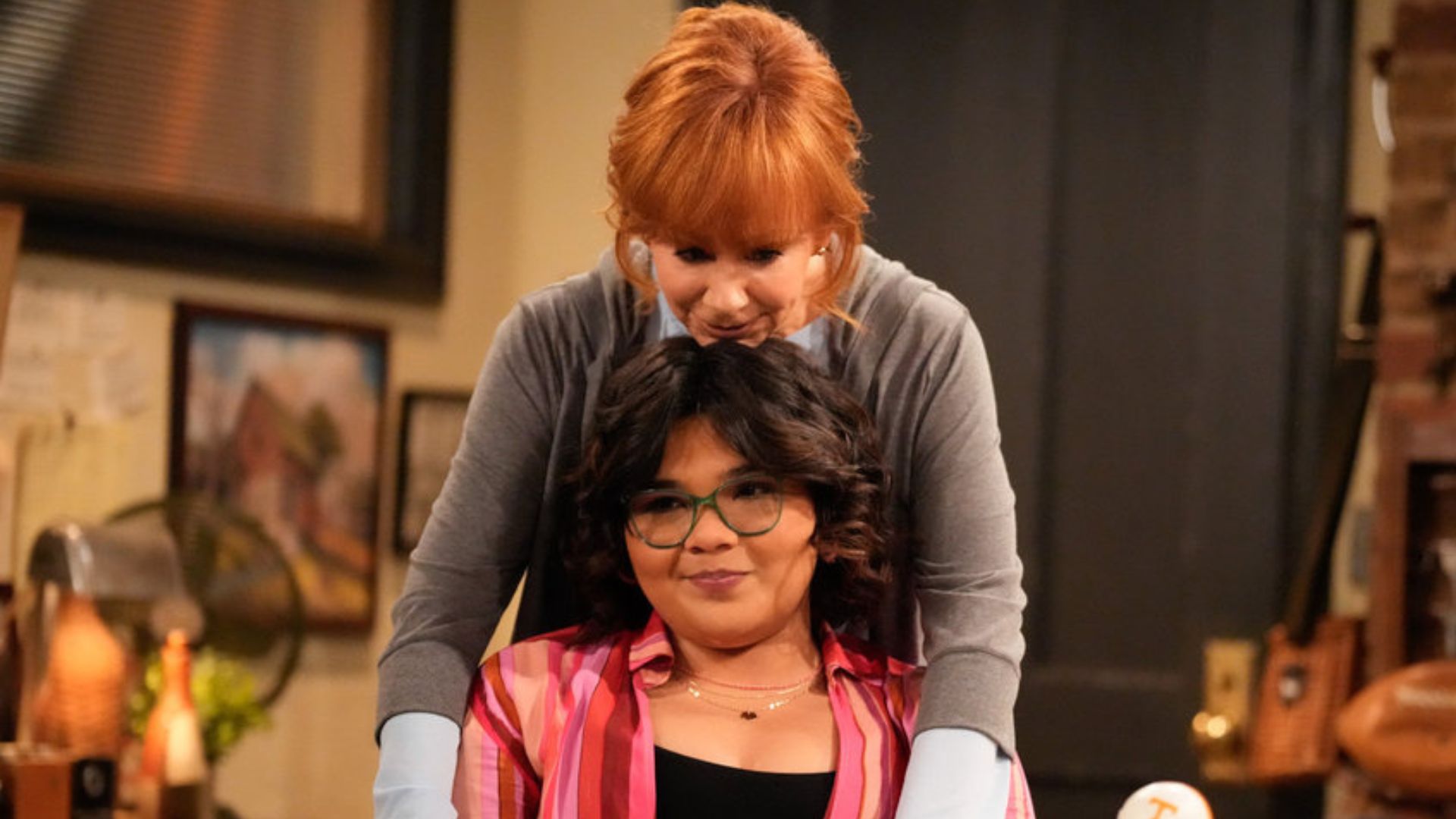 HAPPY'S PLACE -- "Dear Jack" Episode 108 -- Pictured: (l-r) Reba McEntire as Bobbie, Belissa Escobedo as Isabella -- (Photo by: Casey Durkin/NBC)