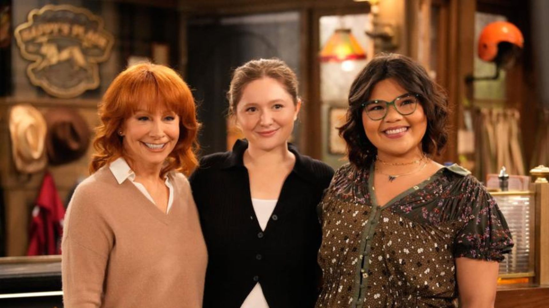 HAPPY'S PLACE -- "The Macallister Girls" Episode 110 -- Pictured: (l-r) Reba McEntire as Bobbie, Emma Kenney as Gracie, Belissa Escobedo as Isabella -- (Photo by: Casey Durkin/NBC)