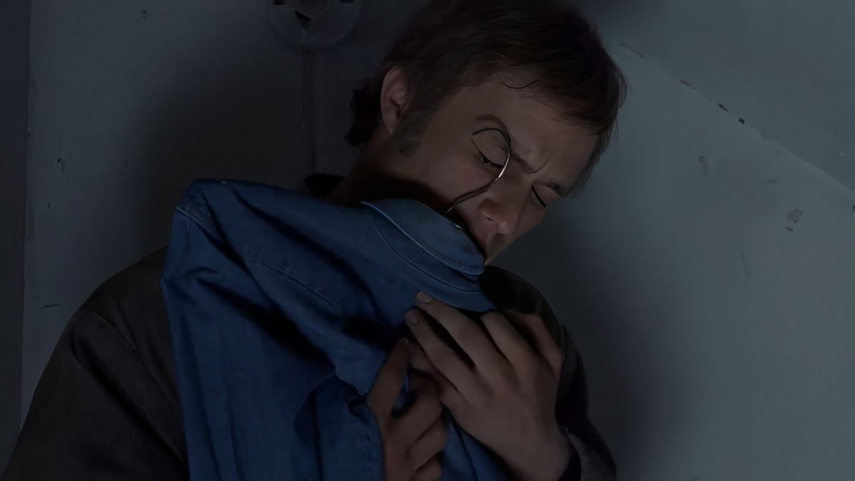 Ennis holds Jack’s shirt in Brokeback Mountain