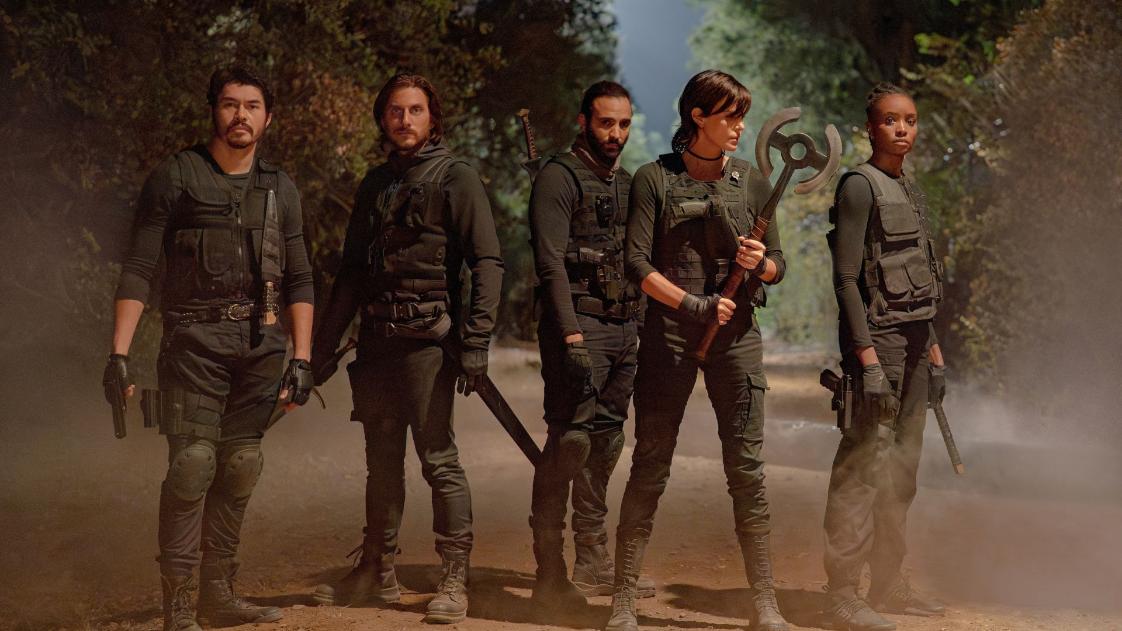 The Old Guard 2 (L-R) Henry Golding as Tuah, Luca Marinelli as Nicky, Marwan Kenzari as Joe, Charlize Theron as Andy and KiKi Layne as Nile in The Old Guard 2. Cr. Eli Joshua Ade/Netflix © 2025