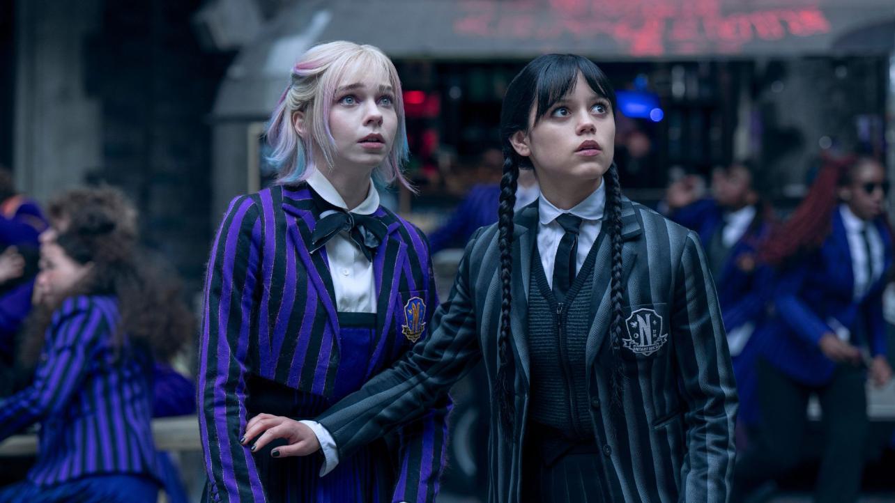 Wednesday. (L to R) Emma Myers as Enid, Jenna Ortega as Wednesday Addams in episode 204 of Wednesday. Cr. Helen Sloan/Netflix © 2025