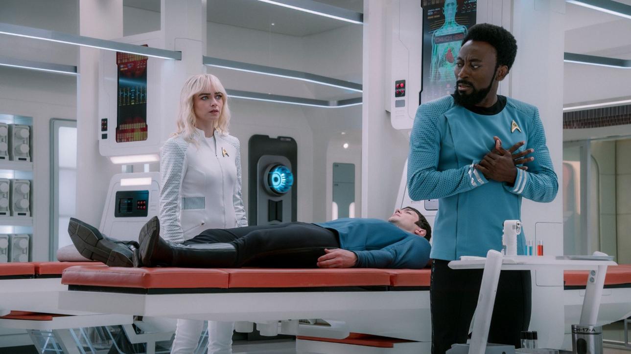 Jess Bush as Christine Chapel, Ethan Peck as Spock, and Babs Olusanmokun as Dr. M’Benga in Star Trek: Strange New Worlds Season 4 Episode 7 "Like Chronitons Through the Hourglass."