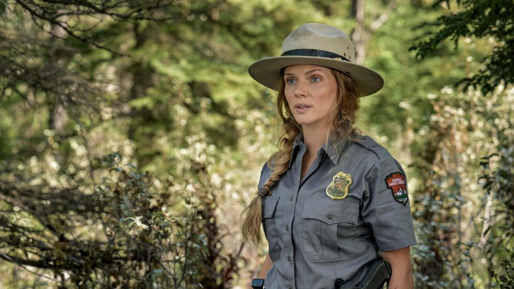 "Track of the Cat" -- Tracy Spiridakos as Anna Pigeon in Anna Pigeon on USA Network. Photo Credit: Michelle Faye/USA Network © VERSANT MEDIA 2025. All Rights Reserved.